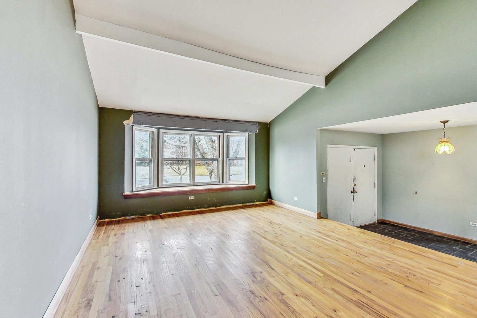 771 Ridge Road Highland Park, IL 60035 - Photo 7 of 54 a view of empty room with wooden floor and fan