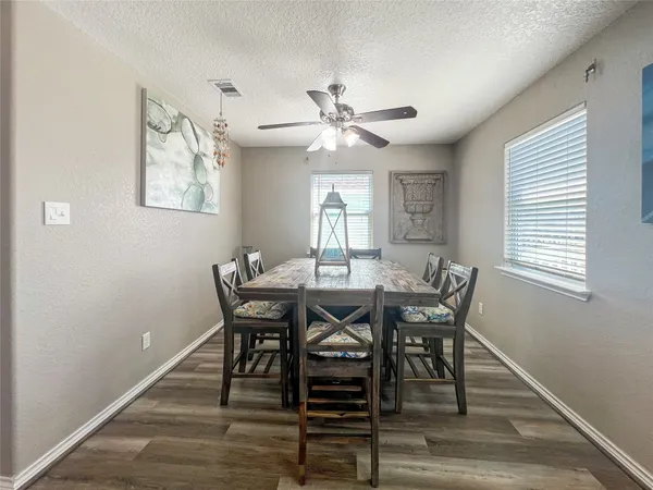 a view of a dining room with furniture window and wooden floor