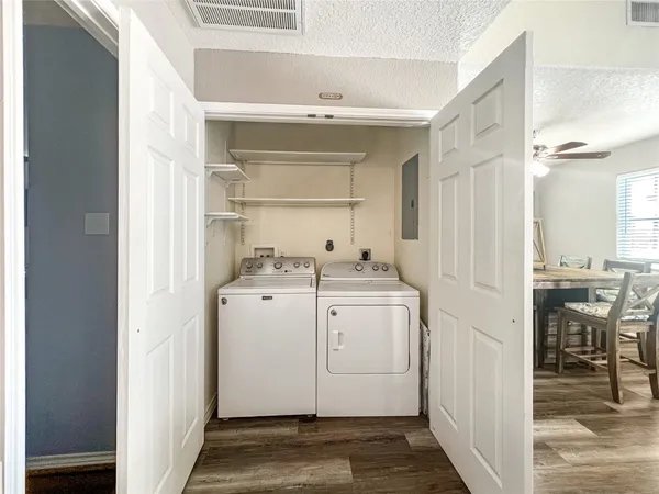 a view of storage and utility room with washer and dryer