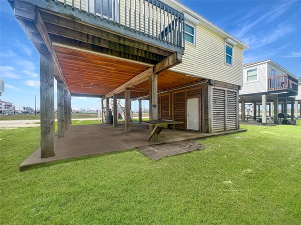a view of a backyard with sitting area