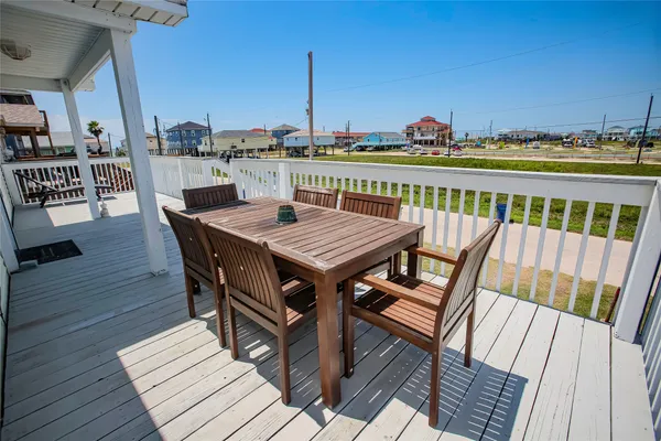 a view of a balcony with furniture