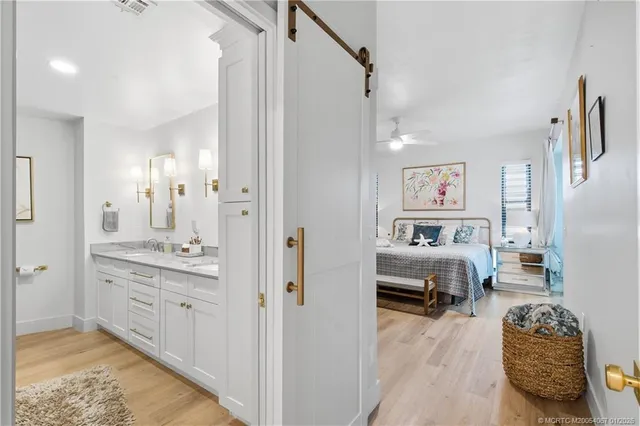 a bedroom with furniture and a bathroom