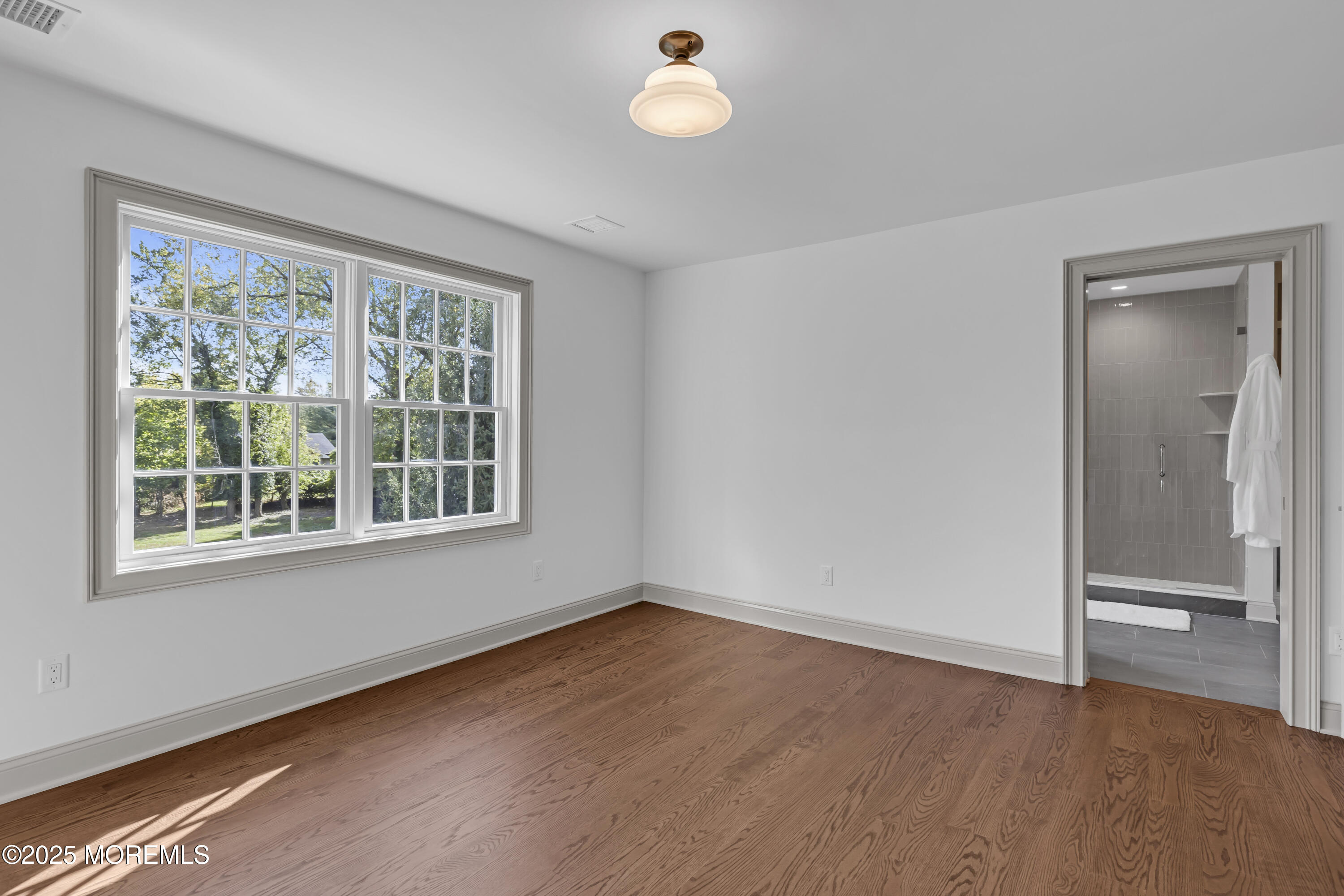 420 Rumson Road Little Silver, NJ 07739 - Photo 37 of 51 an empty room with wooden floor and windows