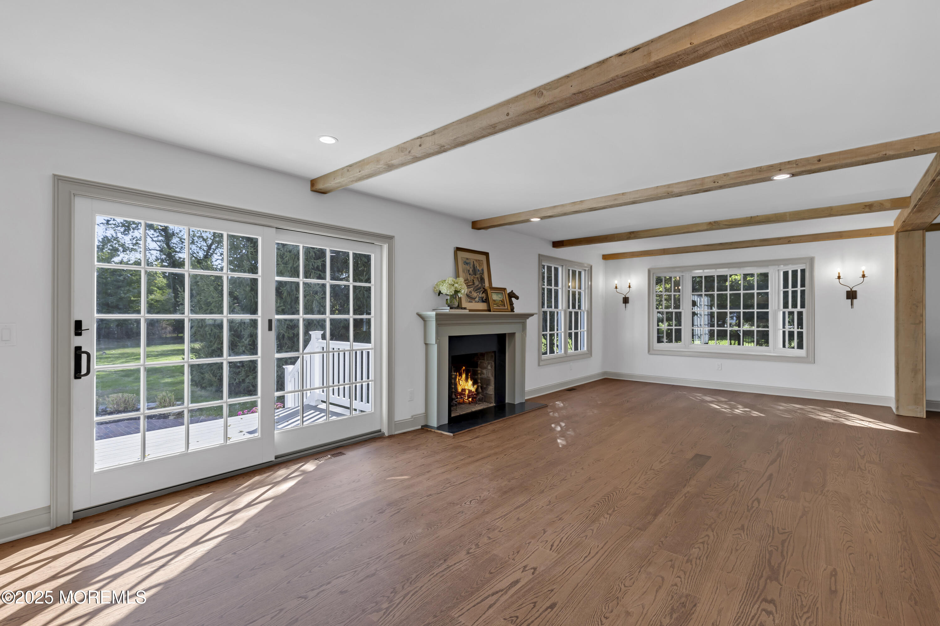 420 Rumson Road Little Silver, NJ 07739 - Photo 5 of 51 a view of an empty room with a window and fireplace