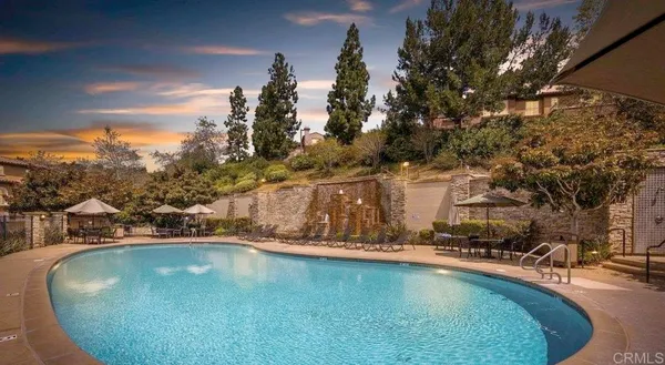 a view of a swimming pool with a yard