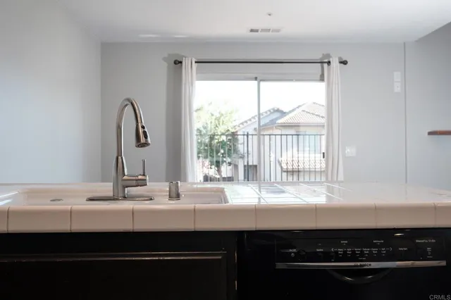 a bathroom with a sink and a window