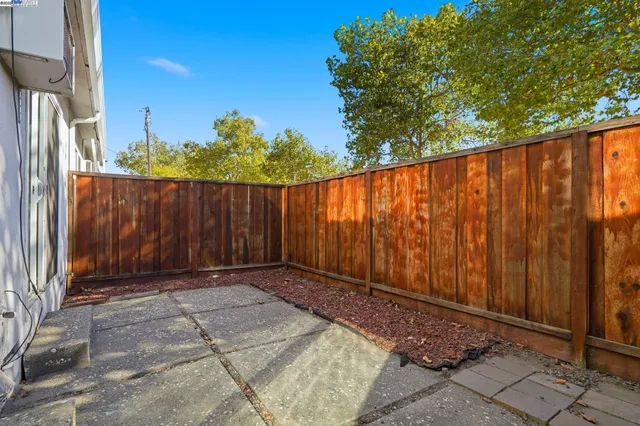 a street view with couple of cars parked on the roadside