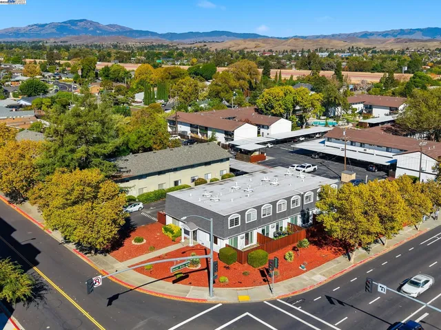 an aerial view of residential houses with outdoor space