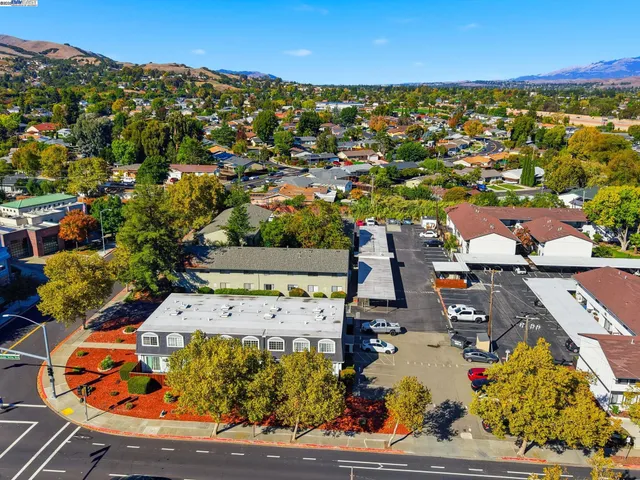 an aerial view of residential houses with outdoor space