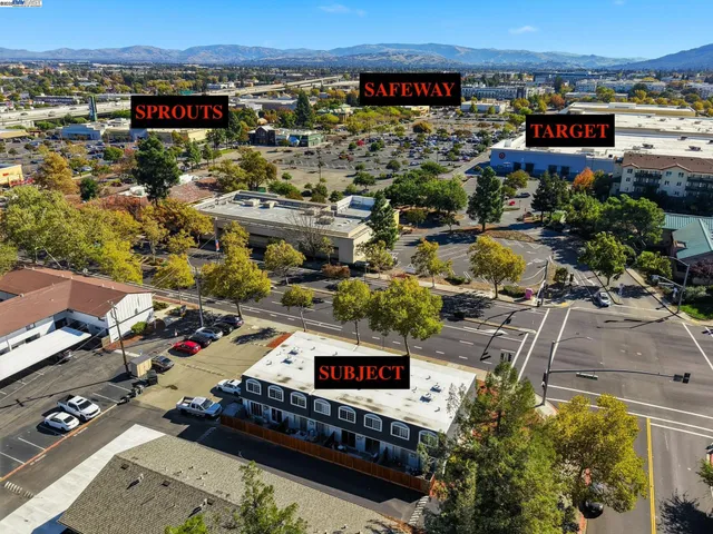 a view of a hallway with wooden shelves