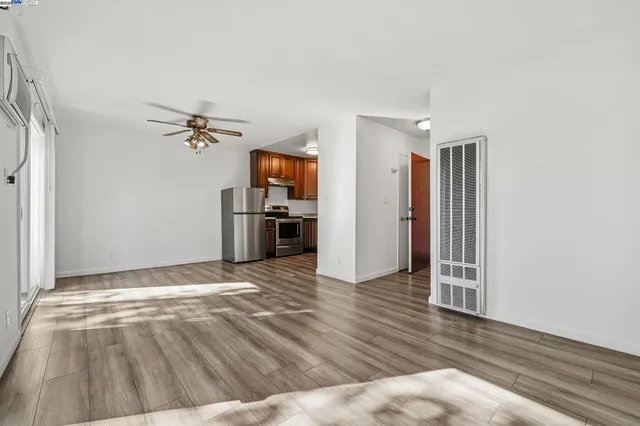 a white refrigerator freezer sitting inside of a kitchen