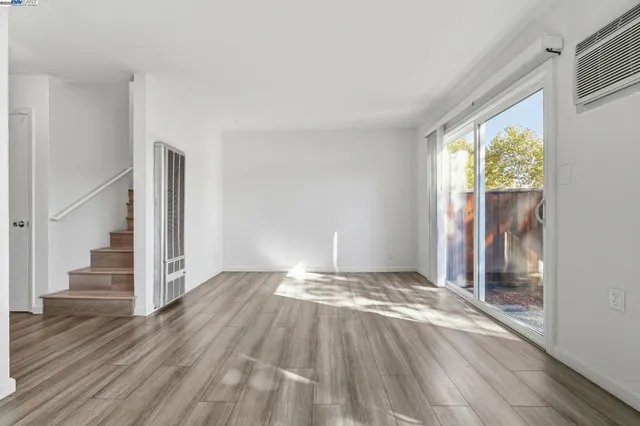 a kitchen with granite countertop a sink stove and cabinets