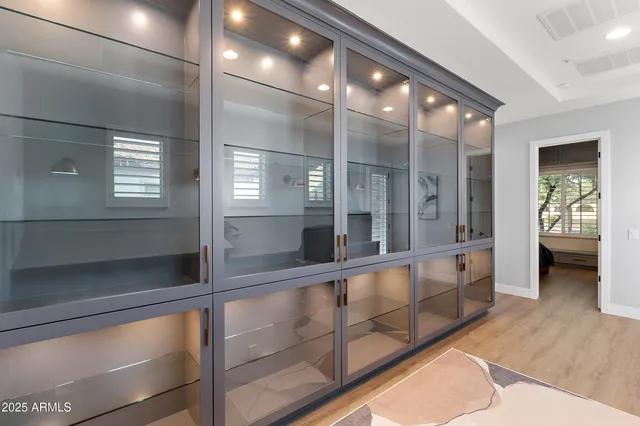 a kitchen with stainless steel appliances a refrigerator and cabinets