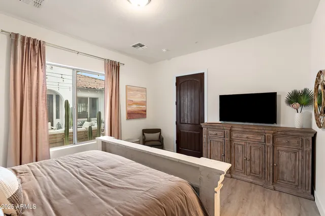 a bathroom with a shower and a sink