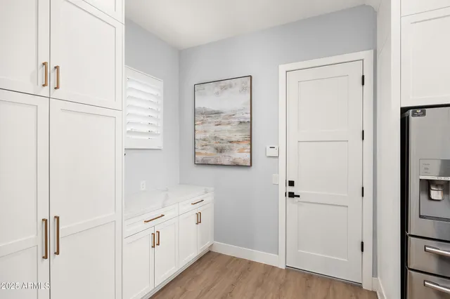 a garage with a couch and a chandelier