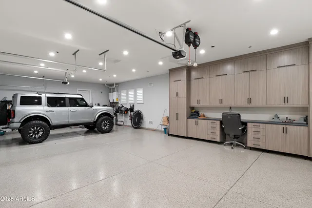 a bathroom with a sink vanity and mirror