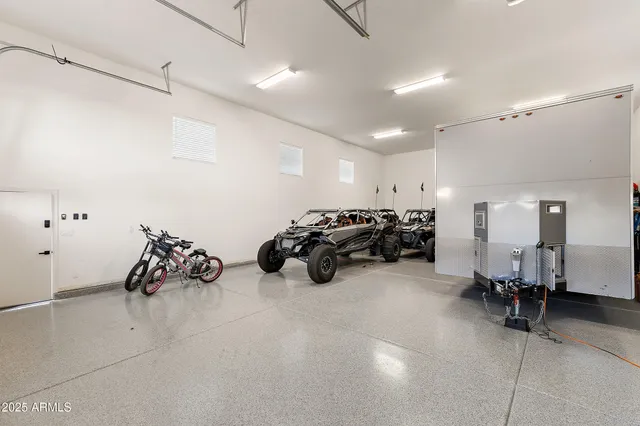 a view of a garage with a wooden fence
