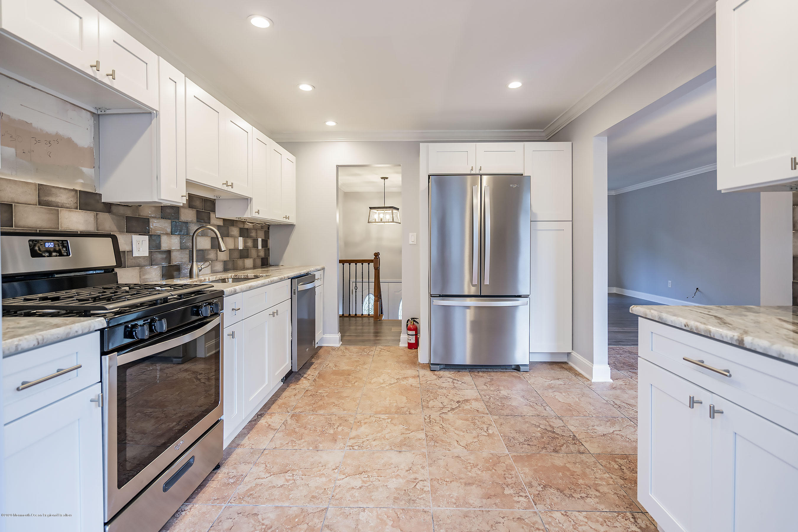 541 Nicholas Road Brick, NJ 08724 - Photo 14 of 40 a kitchen with stainless steel appliances granite countertop a stove a refrigerator and a sink