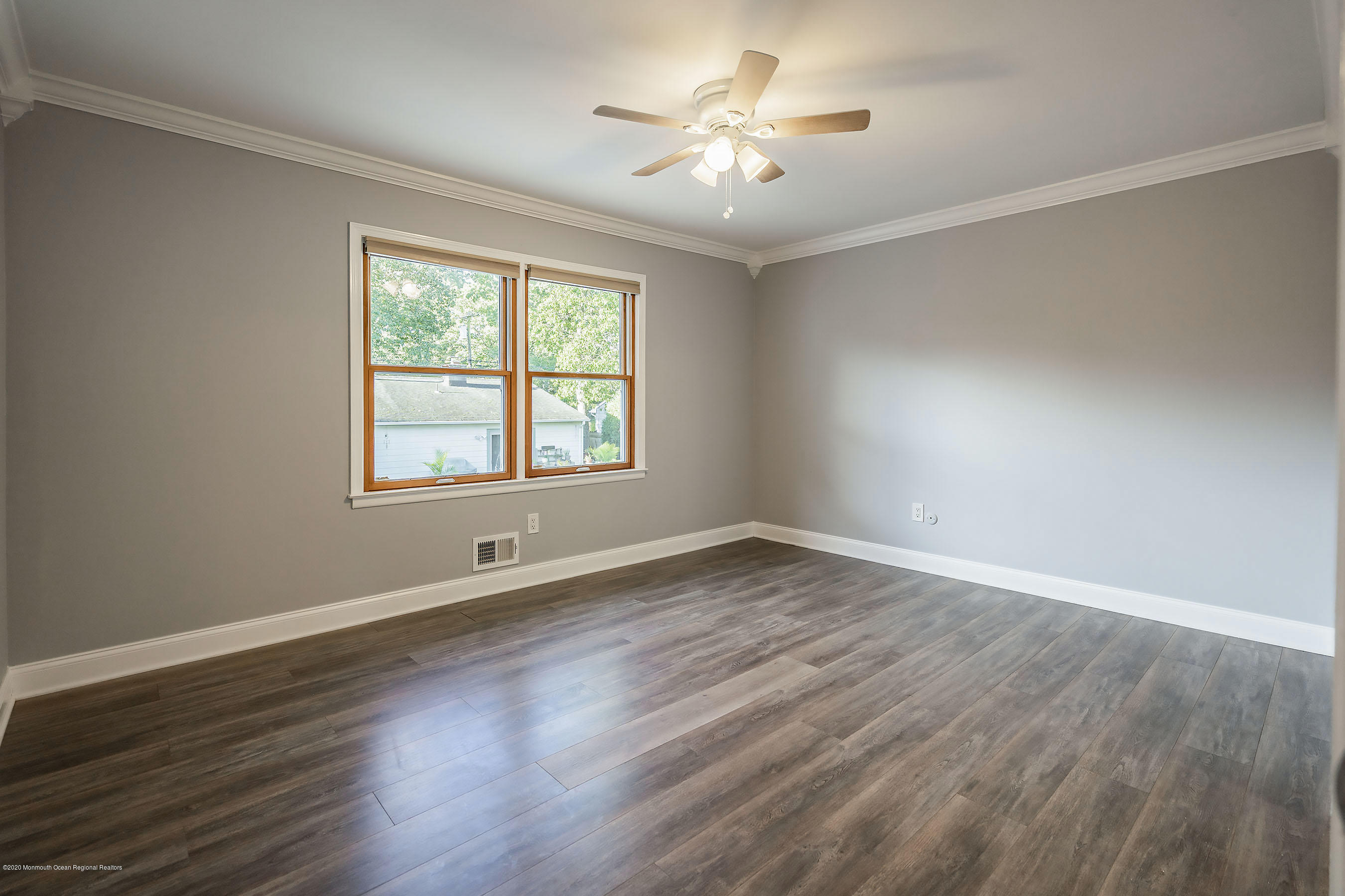 541 Nicholas Road Brick, NJ 08724 - Photo 22 of 40 a view of an empty room with a window and wooden floor