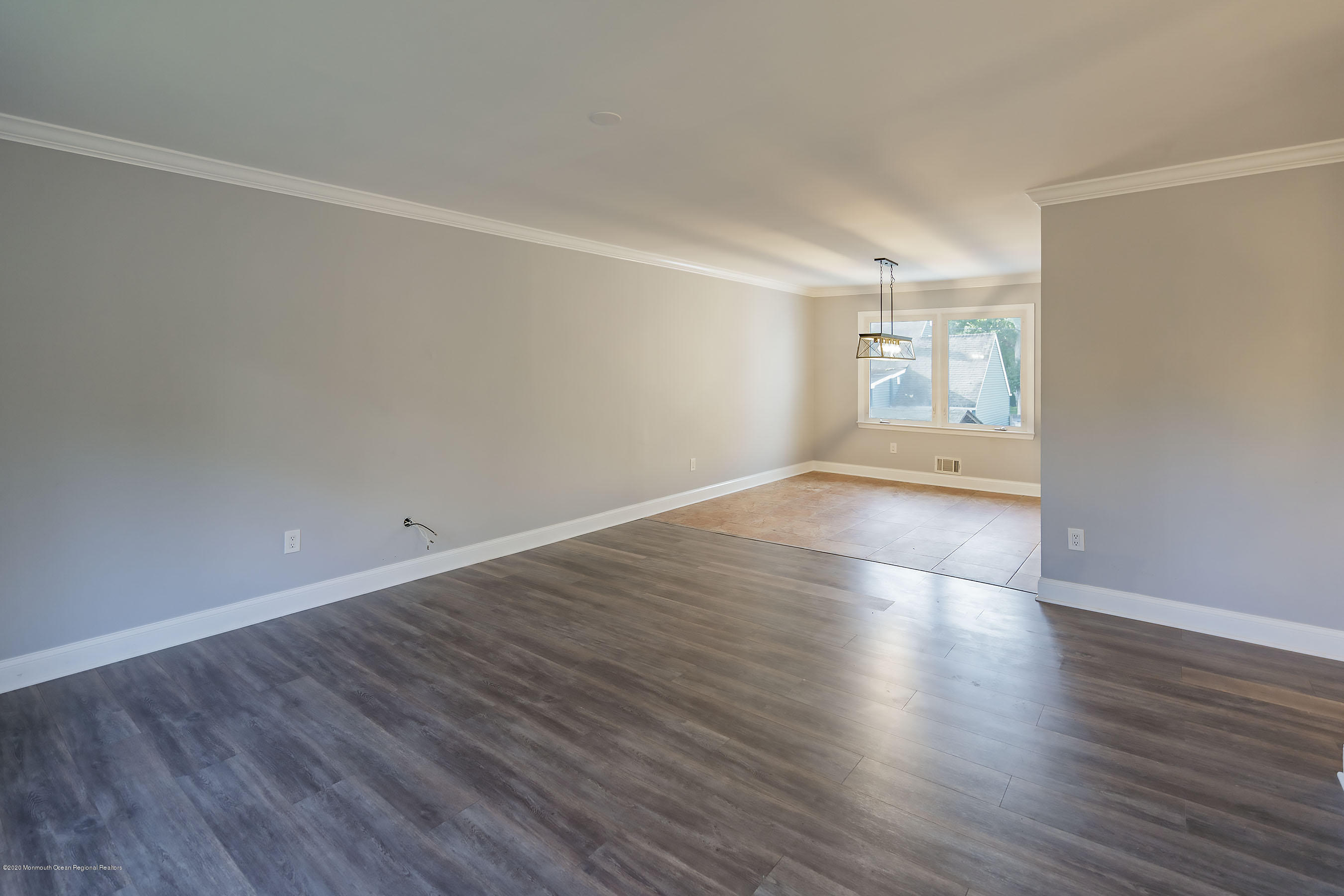 541 Nicholas Road Brick, NJ 08724 - Photo 8 of 40 an empty room with wooden floor and windows
