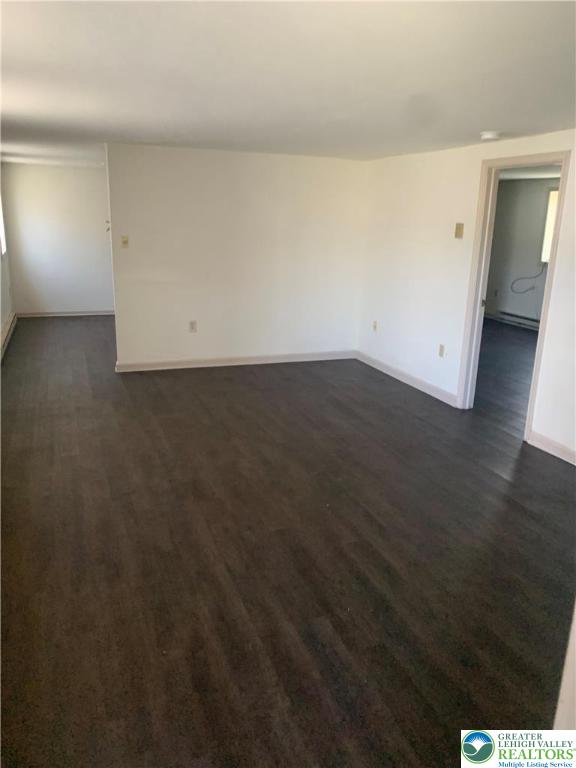 7404 Allemaengel Road, Unit 2 New Tripoli, PA 18066 - Photo 5 of 13 an empty room with a bench