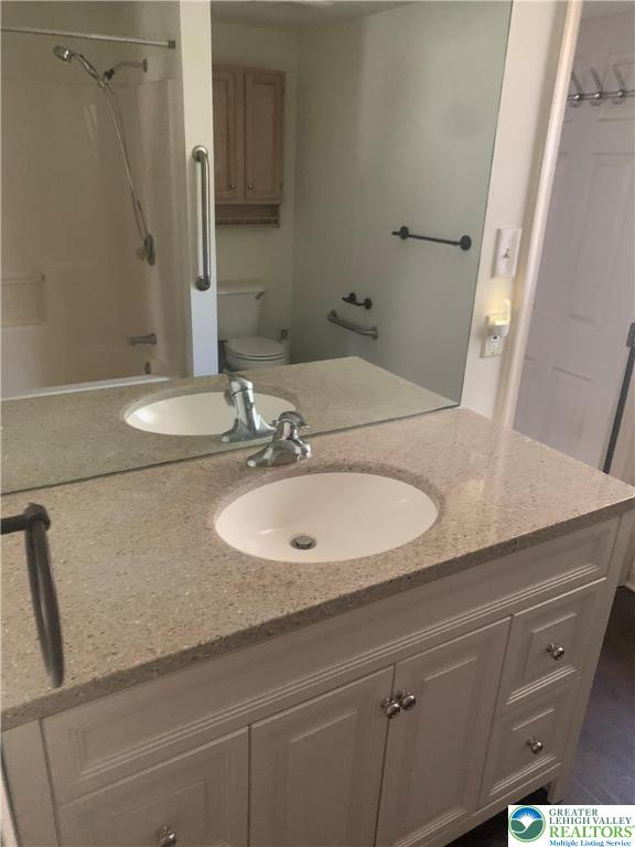 7404 Allemaengel Road, Unit 2 New Tripoli, PA 18066 - Photo 7 of 13 a bathroom with a sink and a mirror