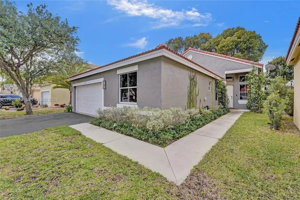 a kitchen with stainless steel appliances a sink dishwasher and cabinets