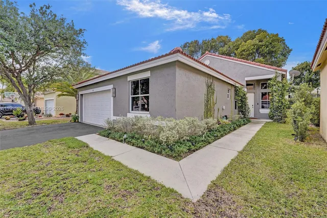 a kitchen with stainless steel appliances a sink dishwasher and cabinets