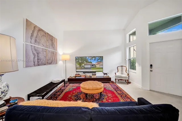 a kitchen with stainless steel appliances granite countertop a sink a stove and cabinets