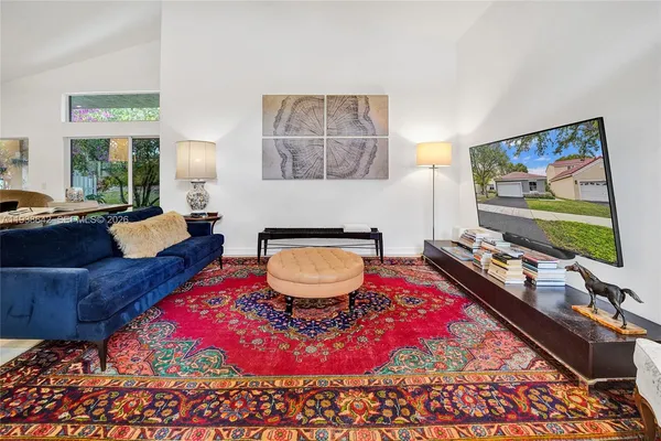 a bedroom with a bed and a mirror