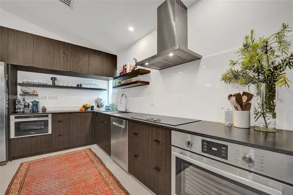 a bedroom with a bed and a lamp