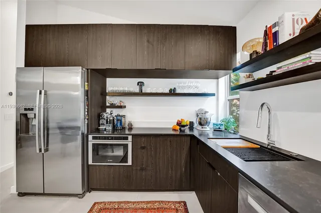 a bedroom with a large bed and a couch