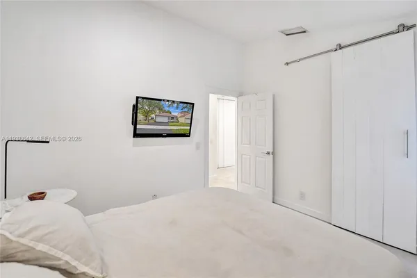 a bathroom with a shower and toilet