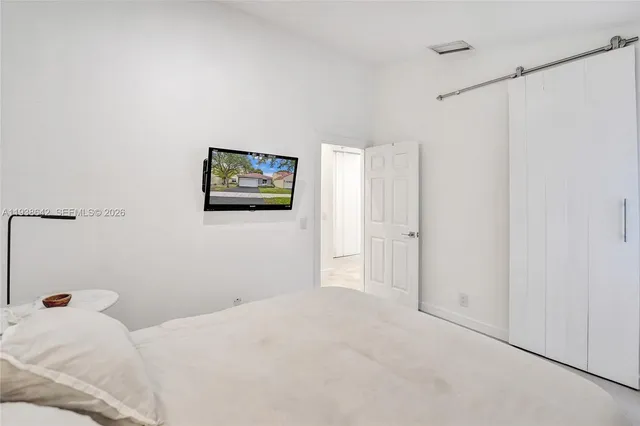 a bathroom with a shower and toilet