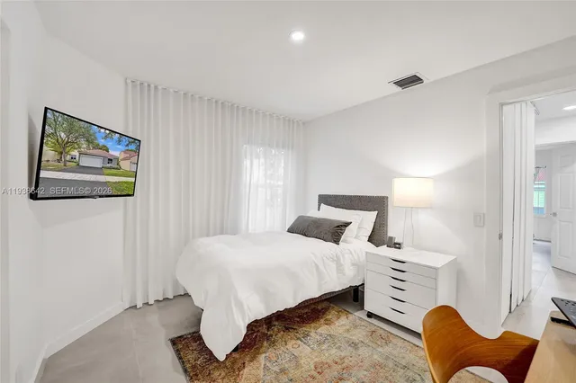 a room with furniture and flat screen tv