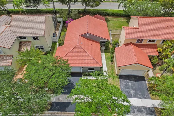 an aerial view of a house with a garden