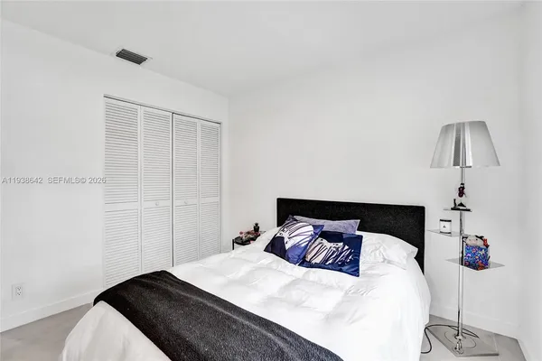 a kitchen with a table and chairs in it