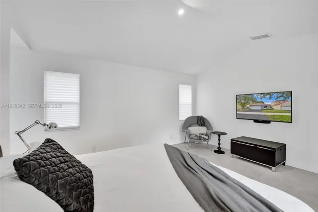 a view of a dining room with furniture and window