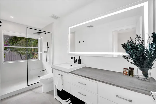 a view of a house with sitting area and garden