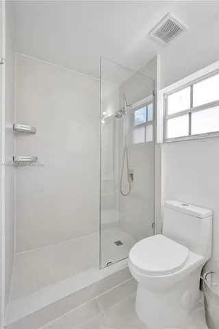 an aerial view of residential houses with outdoor space and street view