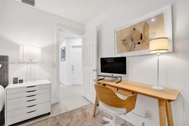 an aerial view of a house with a yard basket ball court and outdoor seating