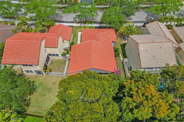 a front view of a house with a yard and a garage