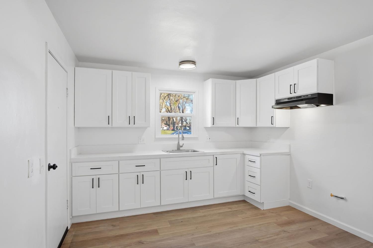 816 Dawn Drive Modesto, CA 95350 - Photo 11 of 22 a kitchen with white cabinets and sink