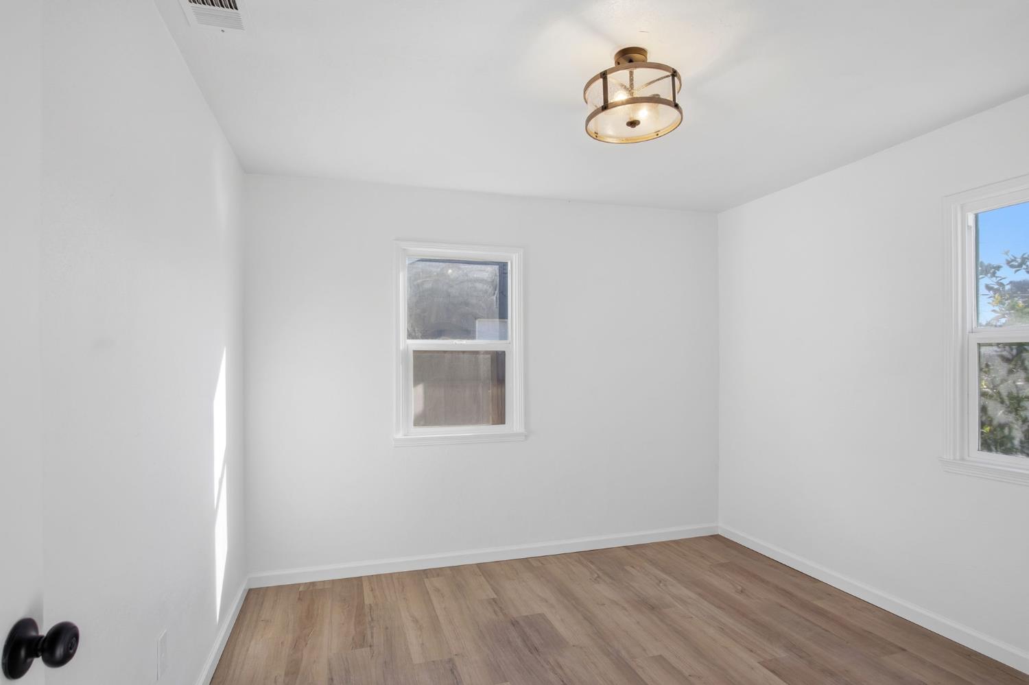 816 Dawn Drive Modesto, CA 95350 - Photo 16 of 22 an empty room with a window