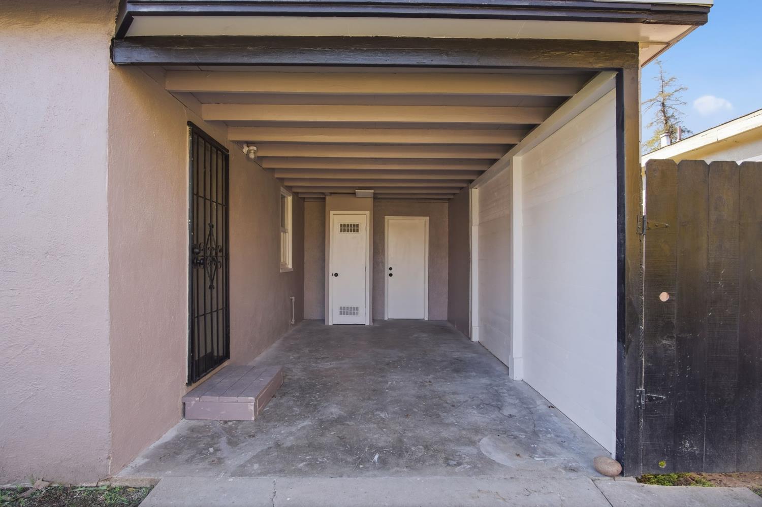816 Dawn Drive Modesto, CA 95350 - Photo 5 of 22 a view of a hallway with wooden shelves