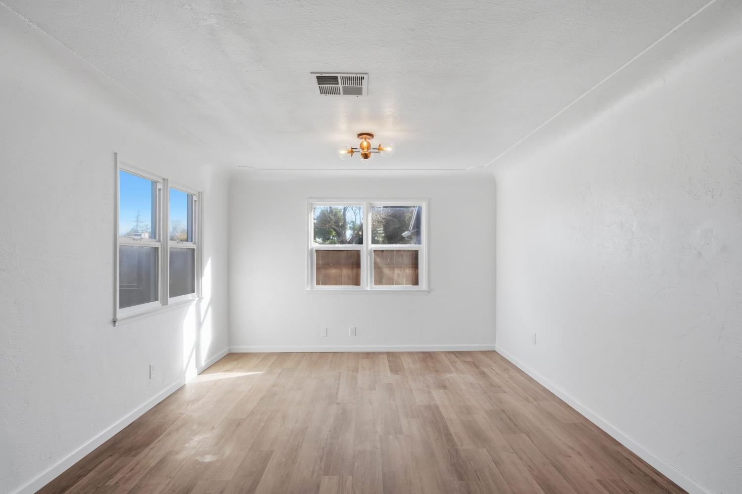 816 Dawn Drive Modesto, CA 95350 - Photo 7 of 22 an empty room with a window