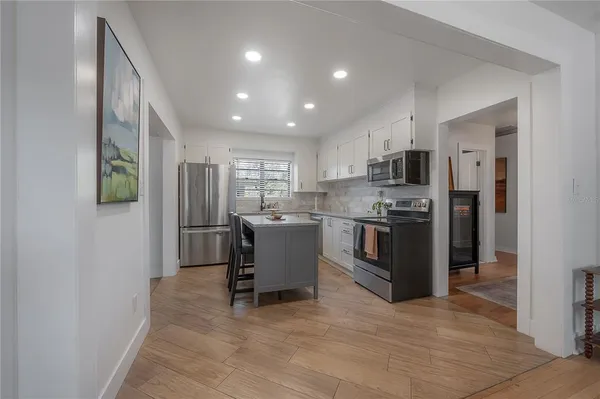 a kitchen with granite countertop a sink and a window