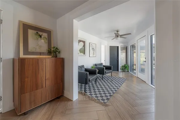 a view of a hallway view with wooden floor and staircase