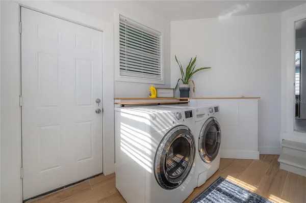 a bed room with a bed and a chandelier