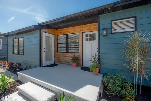 a backyard of a house with seating space